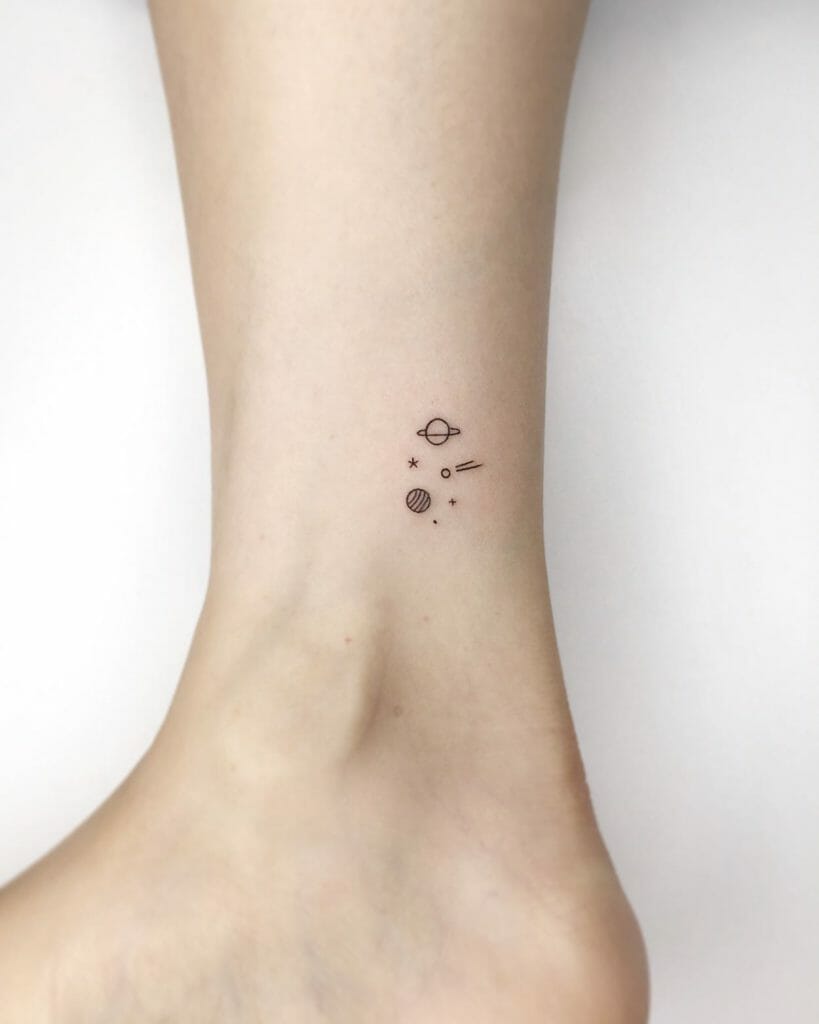 Shooting star tattoo along with planets