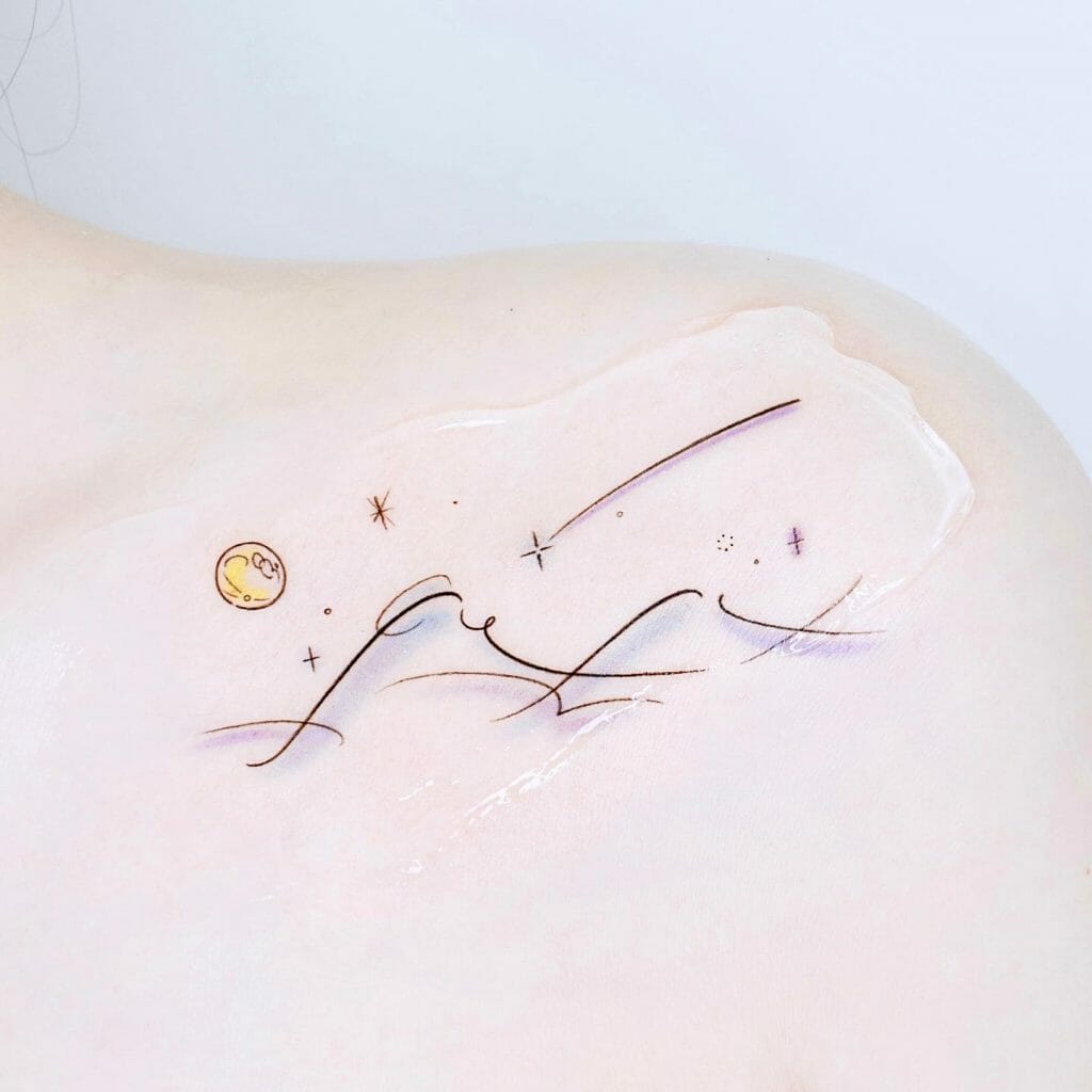 Tattoo of shooting stars along with sea waves