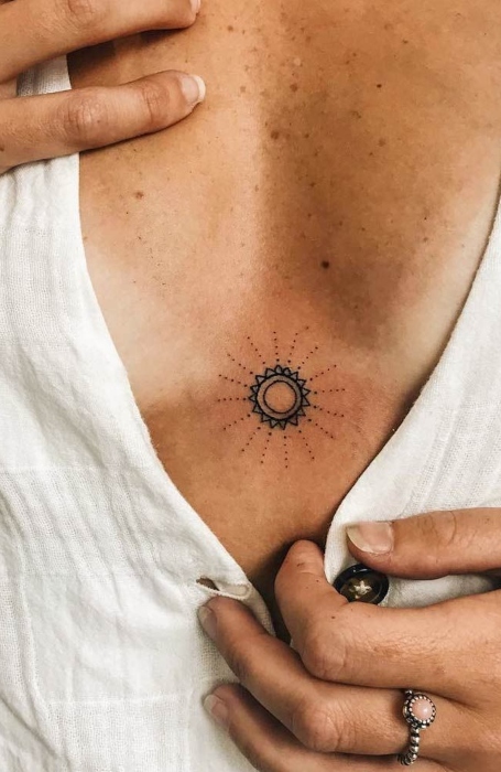 Minimalist Sun Sternum Tattoo Design