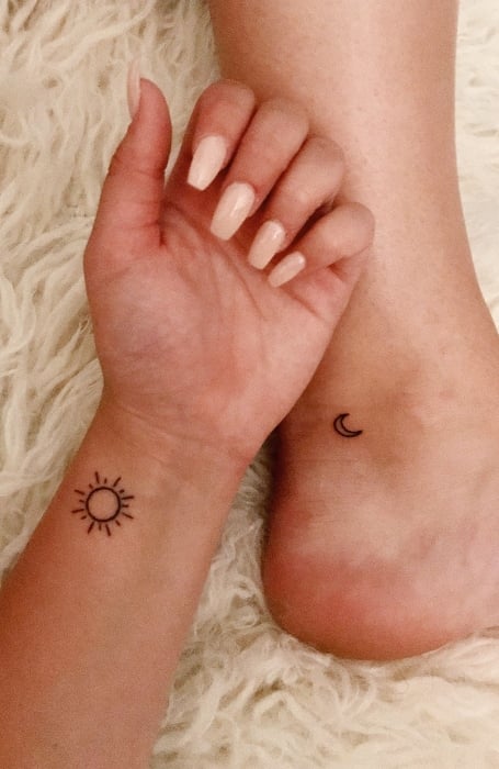 Matching sun and moon tattoos on the wrist and ankle