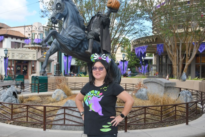 In front of the statue of the Headless Horseman at DCA, Christine used the Magic Eraser on the people in the background.