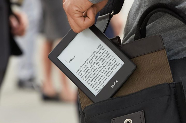 hand held amazon kindle