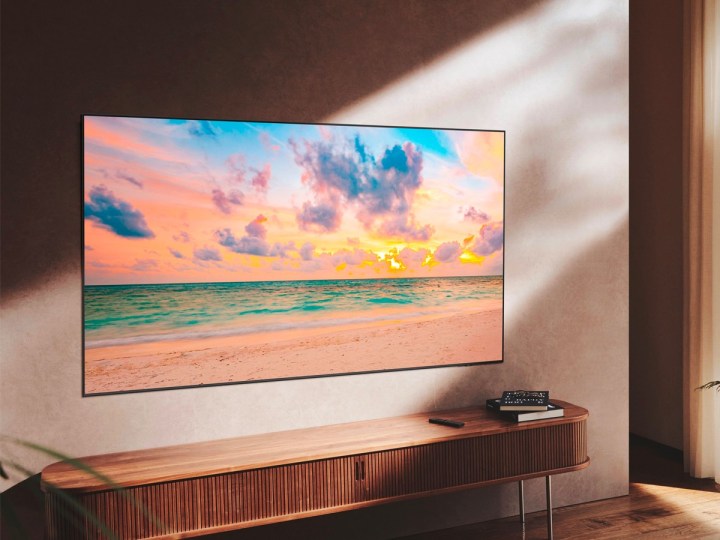 The Samsung 50-inch QN90B QLED 4K Smart TV hangs on a wall in the living room.