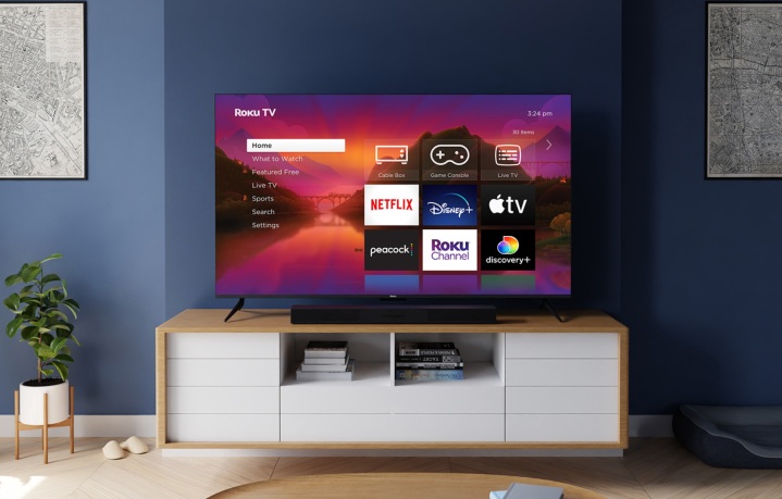 Roku Class Select Series 4K TV on media stand.