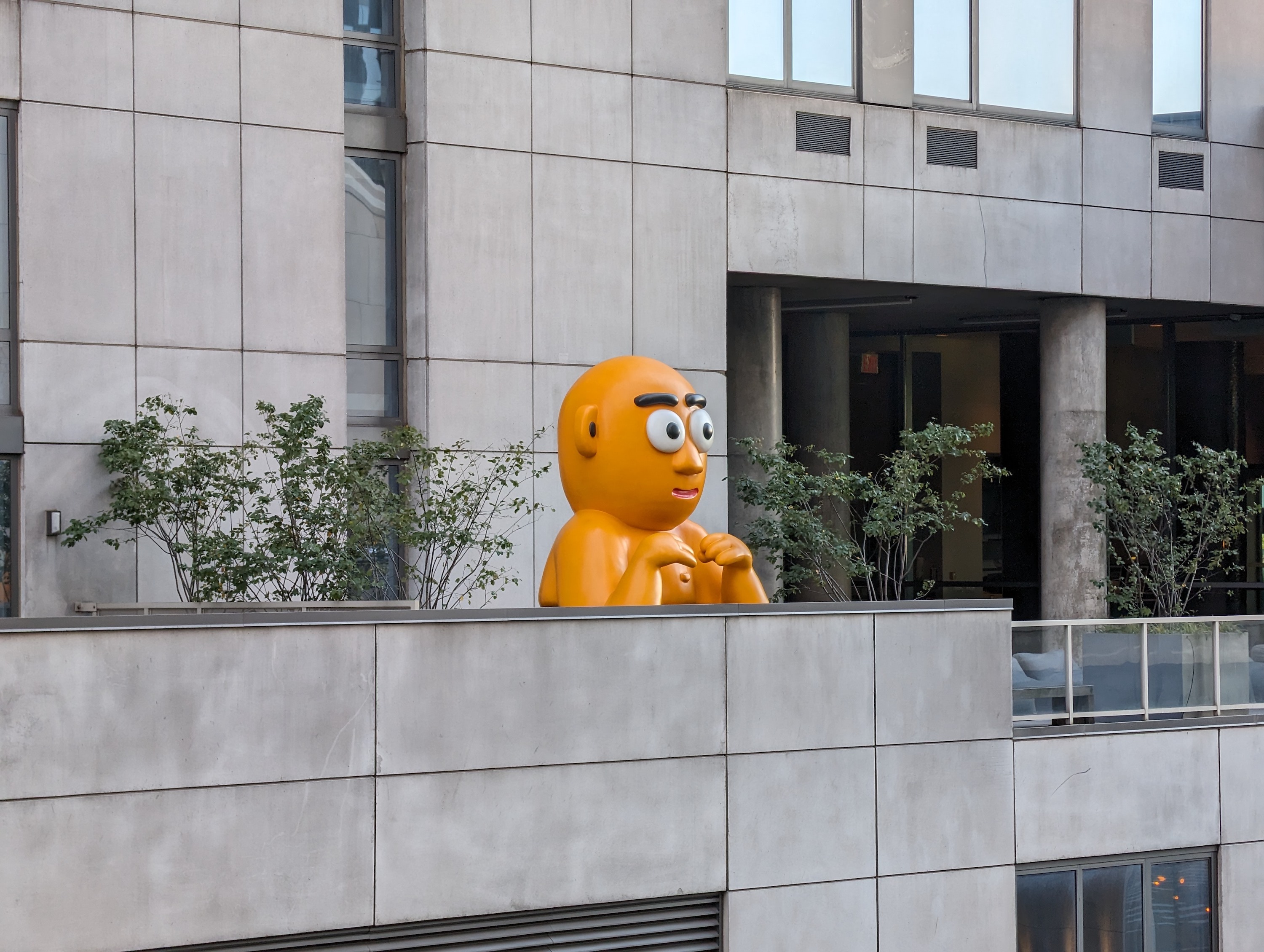 Photo of a yellow statue on a building in NYC, taken with the Google Pixel 8 Pro.