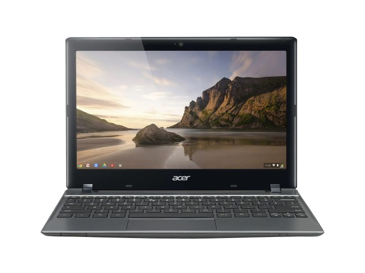 The Acer 11.6-inch Touchscreen Chromebook with a nature sceen as the desktop background.