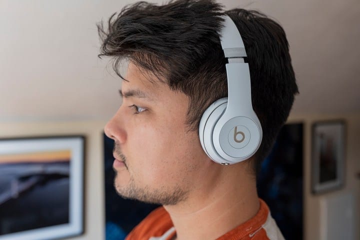 Side angle view of a person wearing Beats Solo3 headphones.