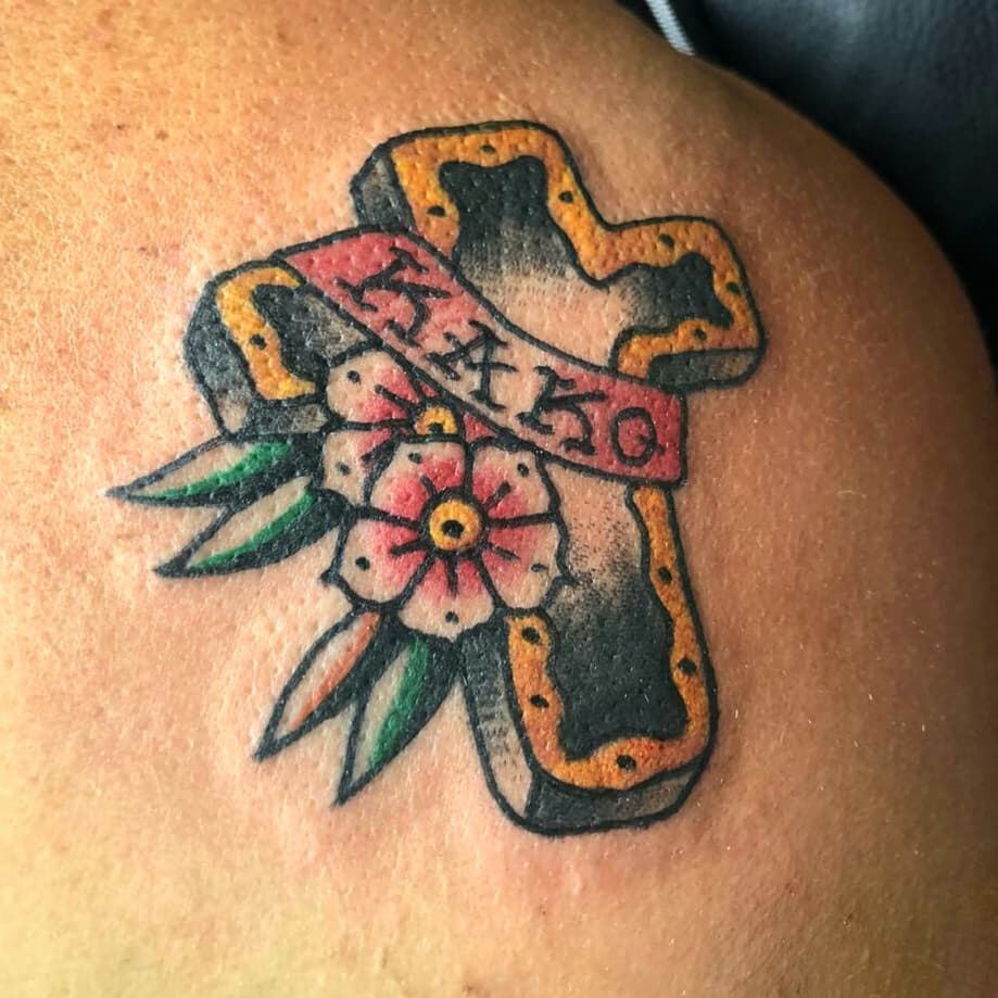 Traditional Cross and Flower Tattoo