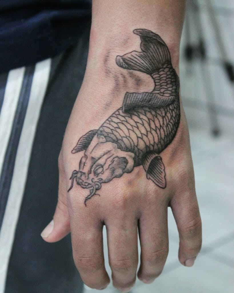 Black and Gray Koi Fish Hand Tattoo Design