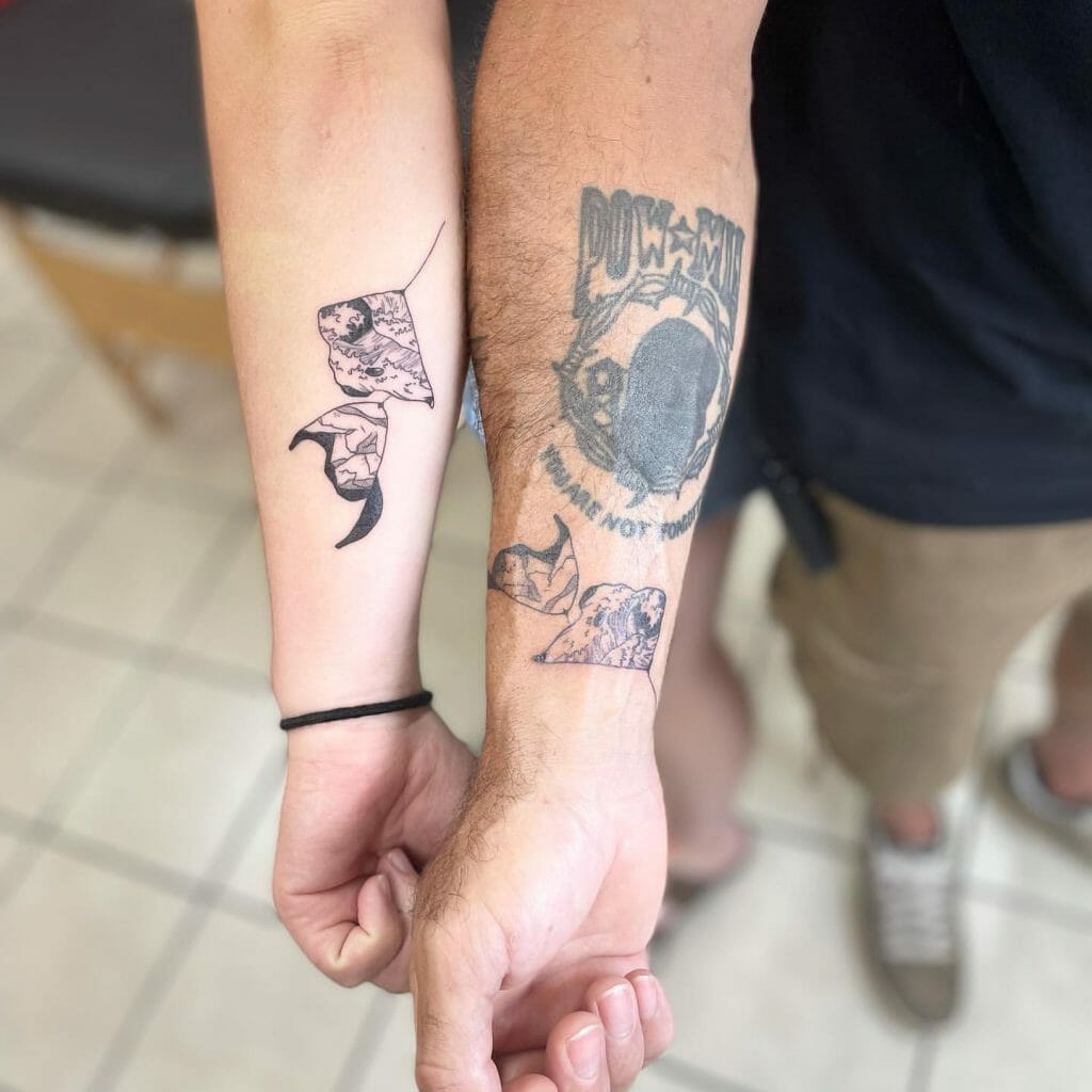 Matching Father-Daughter Puzzle Piece Tattoos.