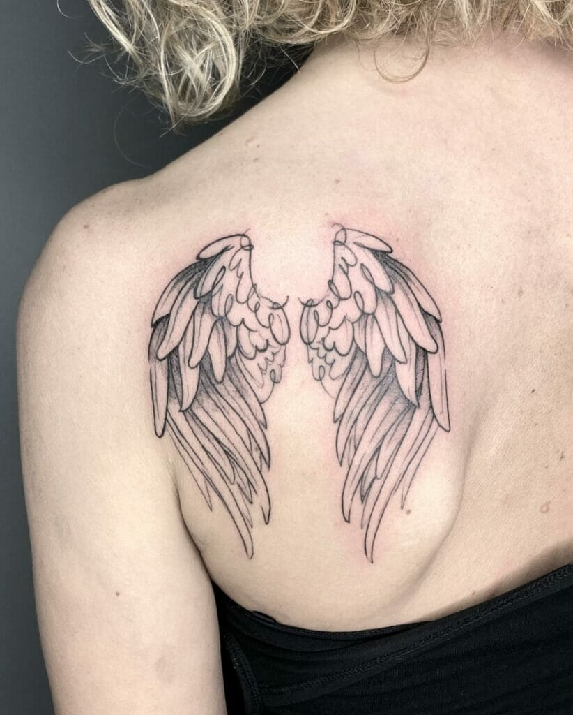 Tiny Angel Wings Tattoo