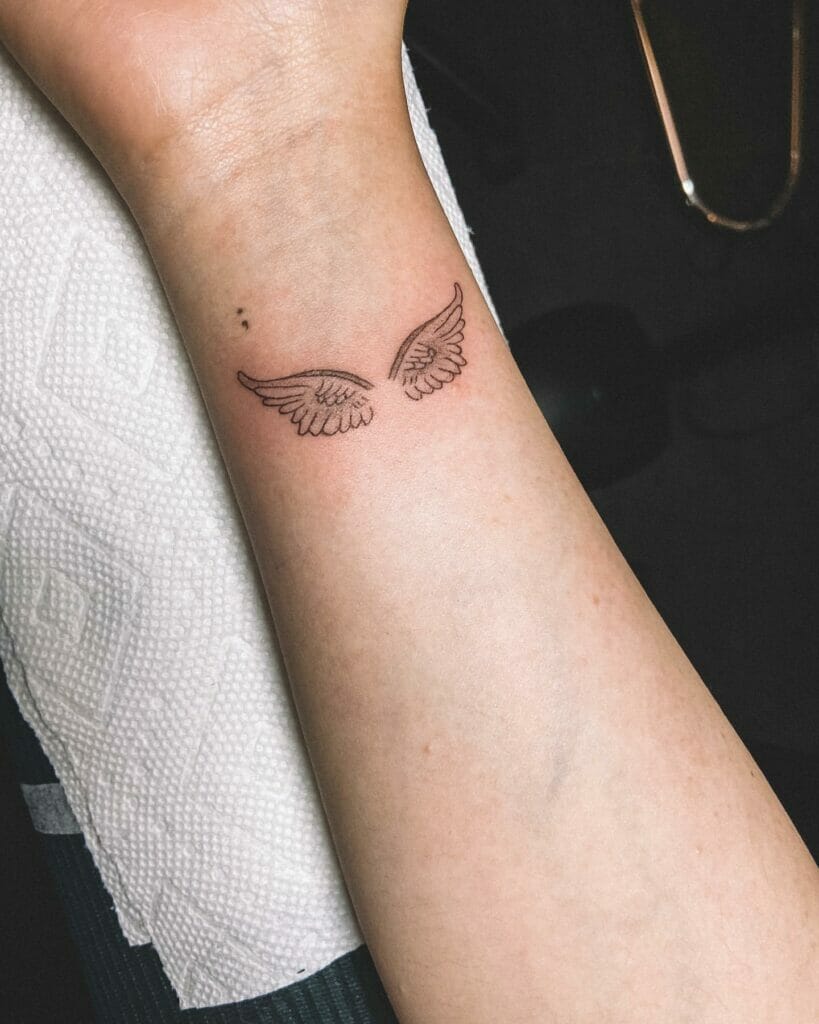 Tiny Angel Wings Tattoo