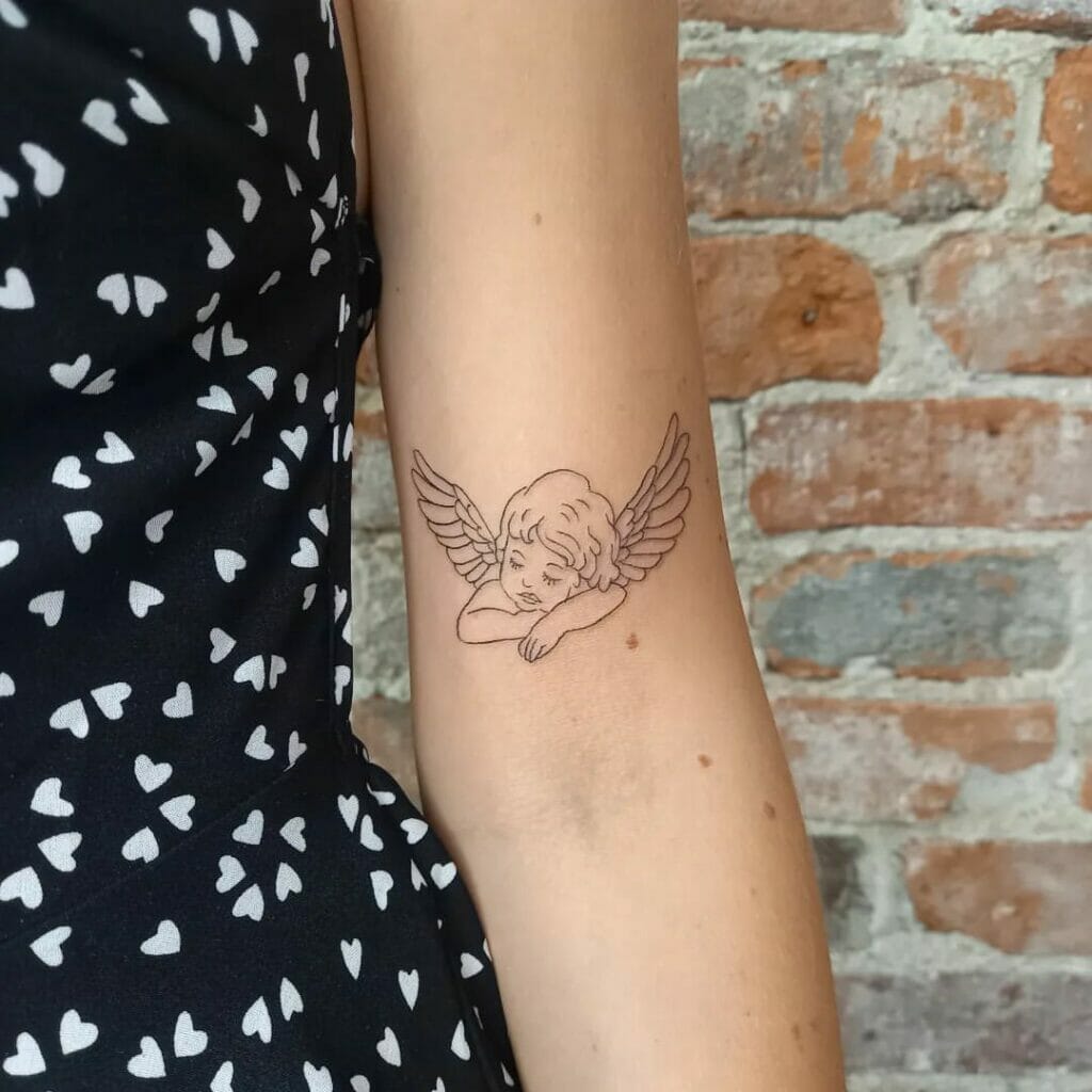 Tiny Angel Wings Tattoo