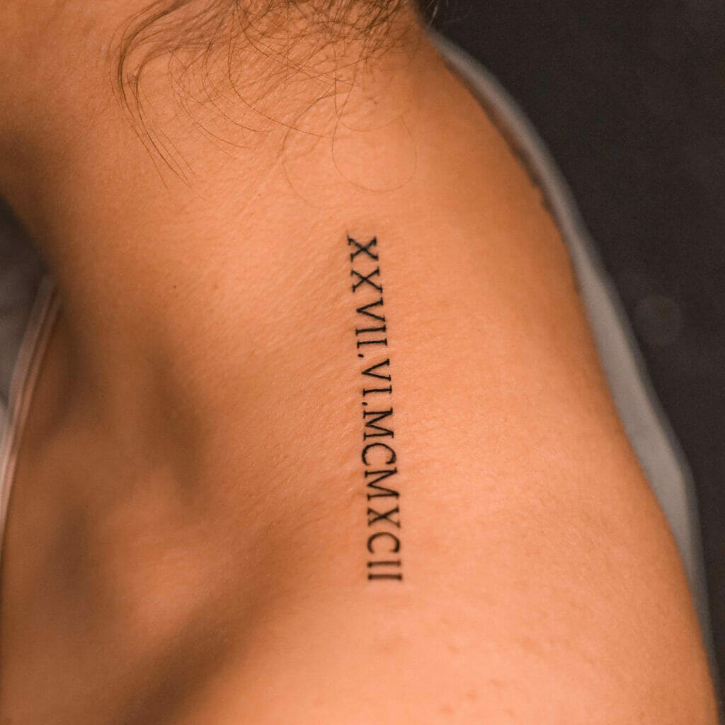 Roman Numerals Tattoo Arm