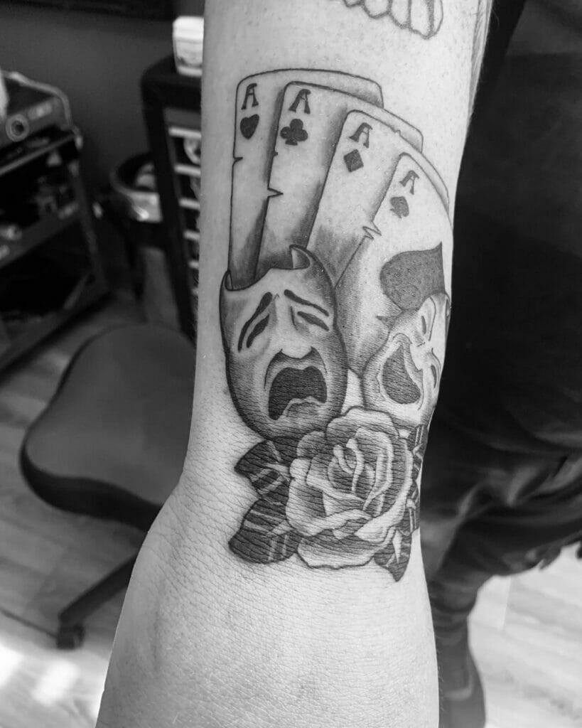 Black And Grey Larger Design Simple Drama Mask Tattoo