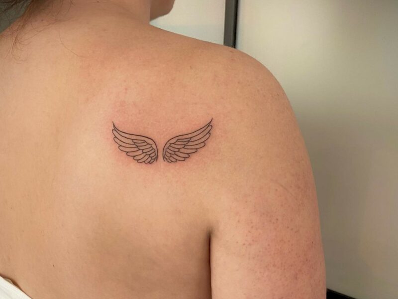 Tiny Angel Wing Tattoo