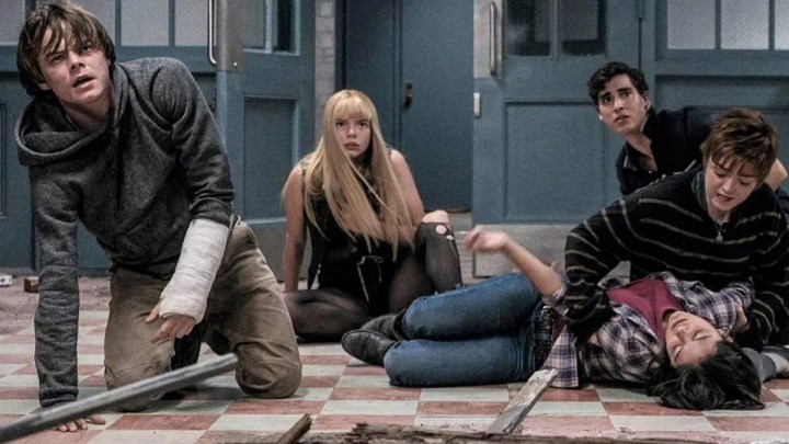 The teenagers are lying on the floor in The New Mutants.