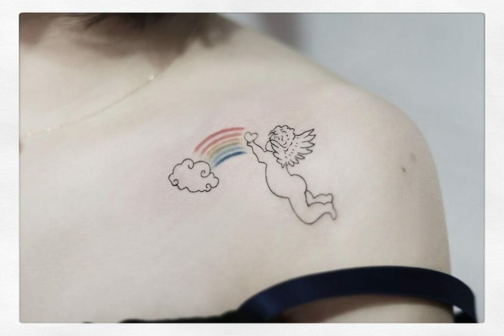 A simple baby angel tattoo with a rainbow