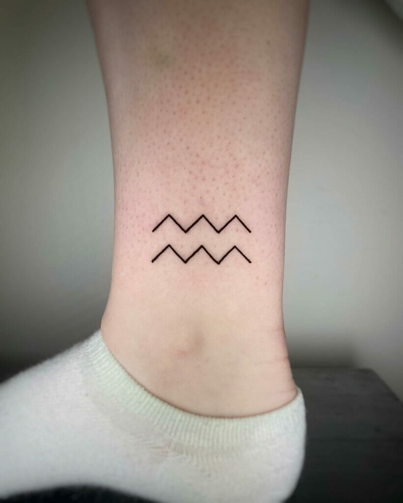 Aquarius Glyph Tattoo For Ladies