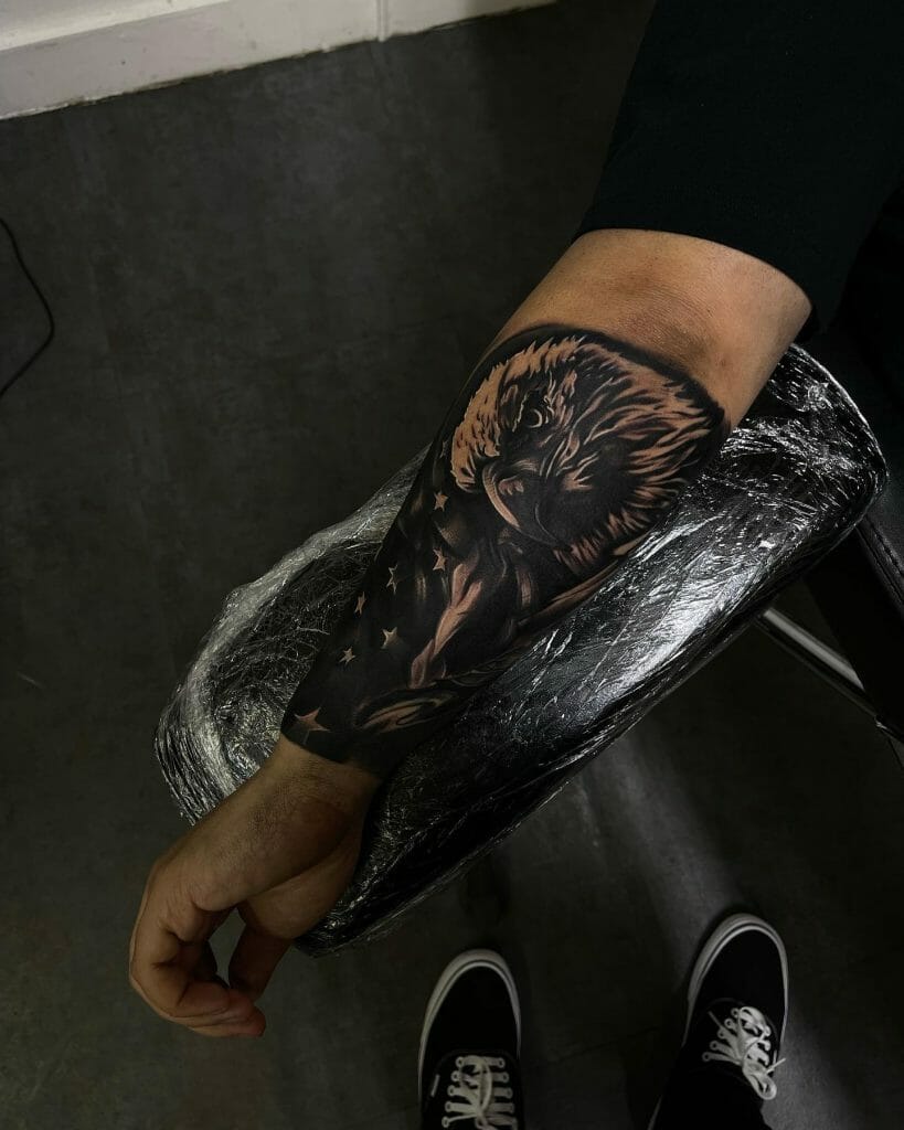 Bald Eagle Head On American Flag Forearm Tattoo