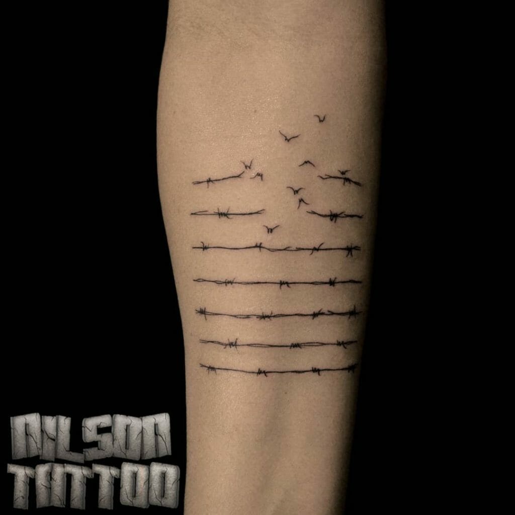 Flock of birds on barbed wire tattoo