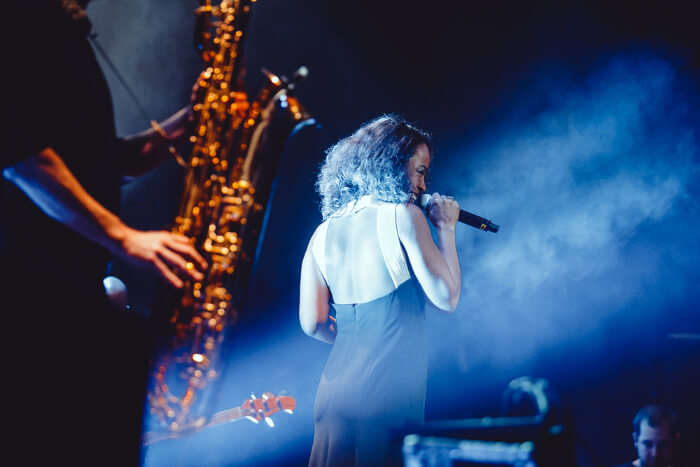 A singer performing before the crowd on a Jazz night in a club