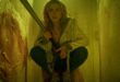 Kiernan Shipka crouches with a bat in Totally Killer