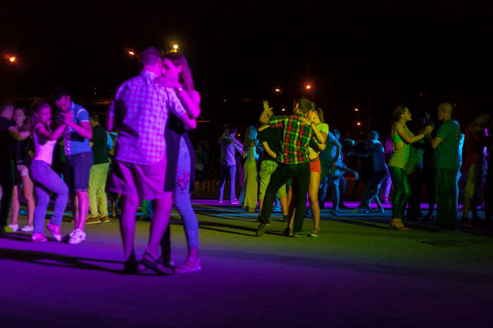 Couples enjoying salsa dance at a club