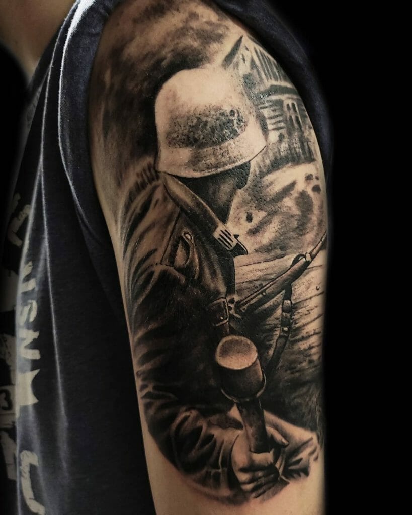 Black and grey tattoo of a WWII soldier in combat gear holding a grenade, featuring realistic shading and historic wartime imagery.