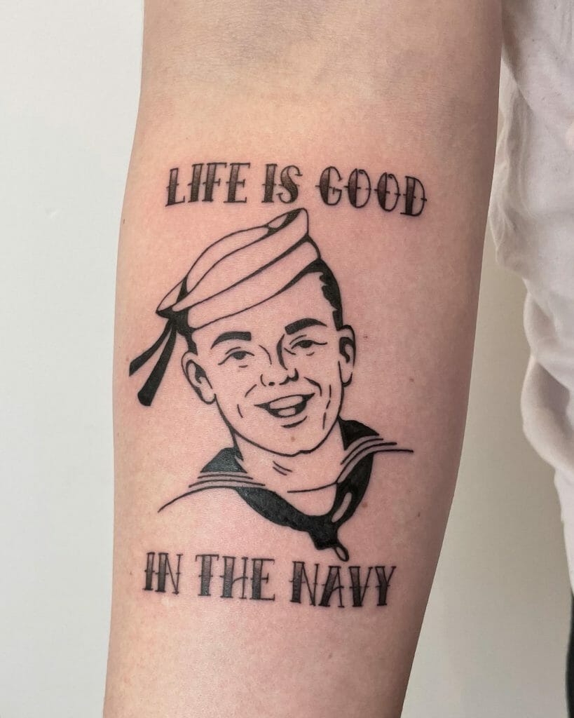 Black line tattoo of a smiling sailor with the text 'Life is Good in the Navy' above and below the portrait.