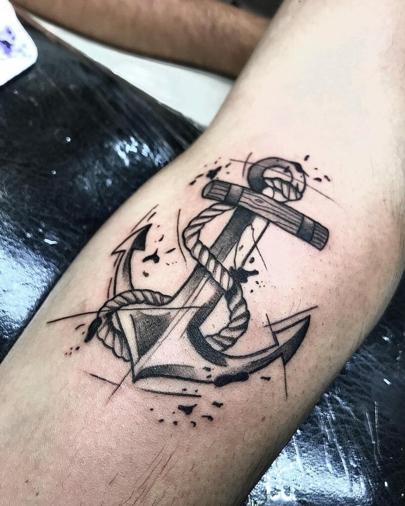 Black and grey anchor tattoo with a rope wrapped around it, featuring modern splatter elements and line work