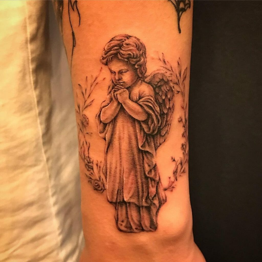 Praying baby angel tattoo