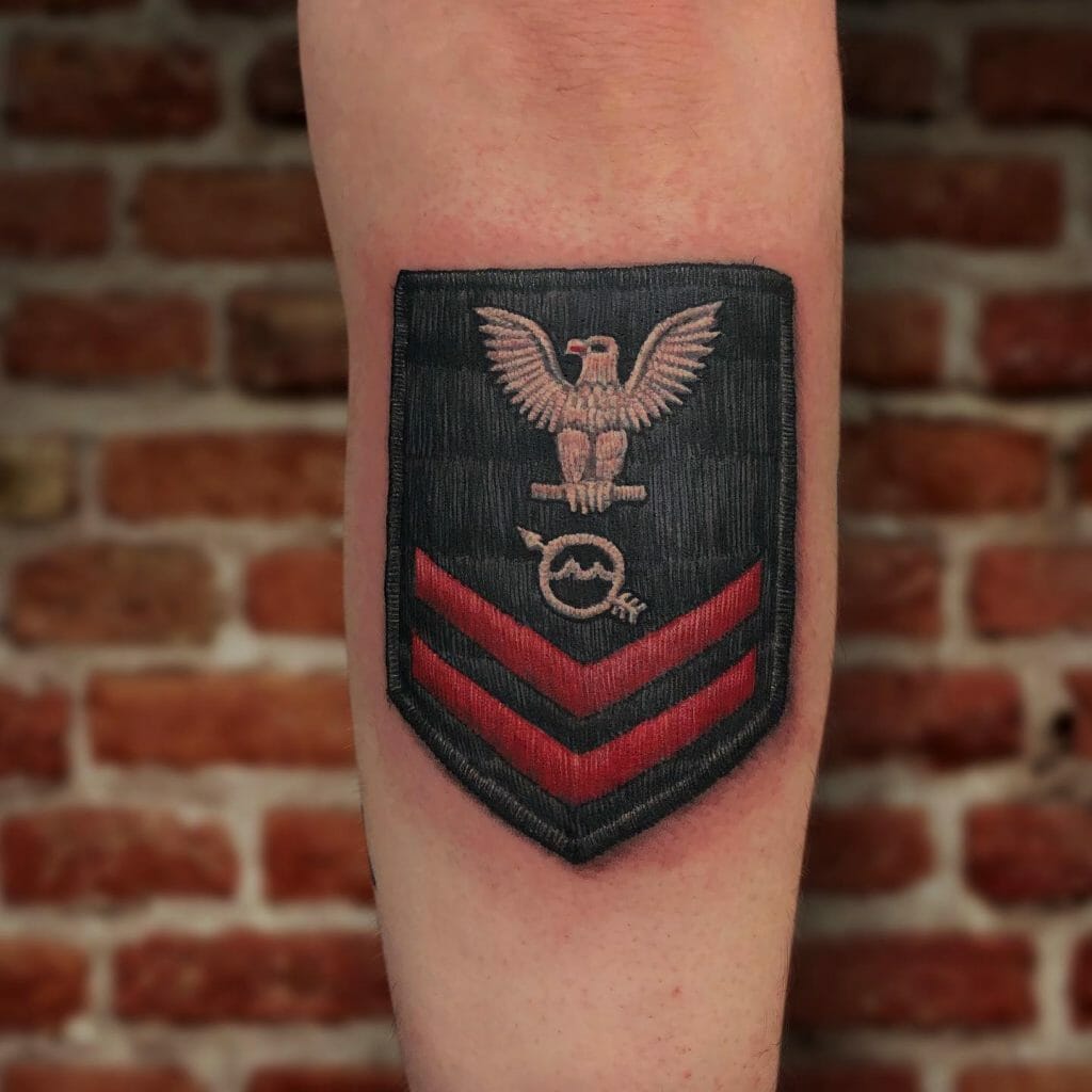 U.S. Navy Petty Officer rating badge tattoo featuring an eagle, crossed anchors, and red chevrons