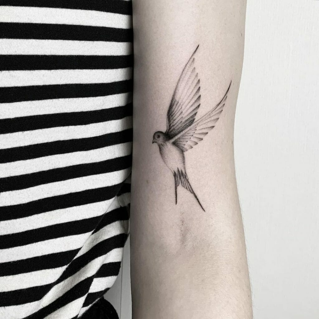 Small Black Bird Tattoo