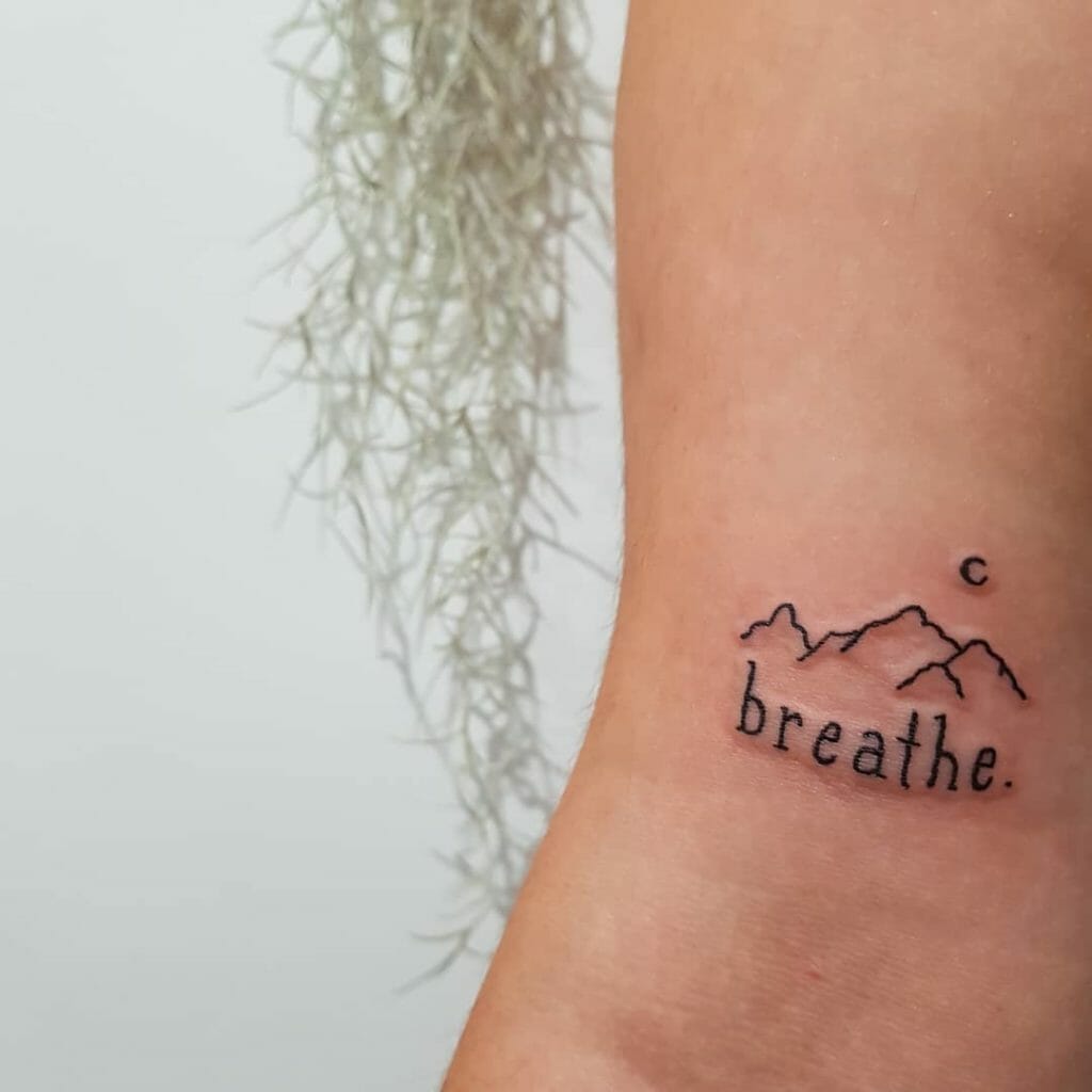 Small Mountain Scenery Breathe Tattoo