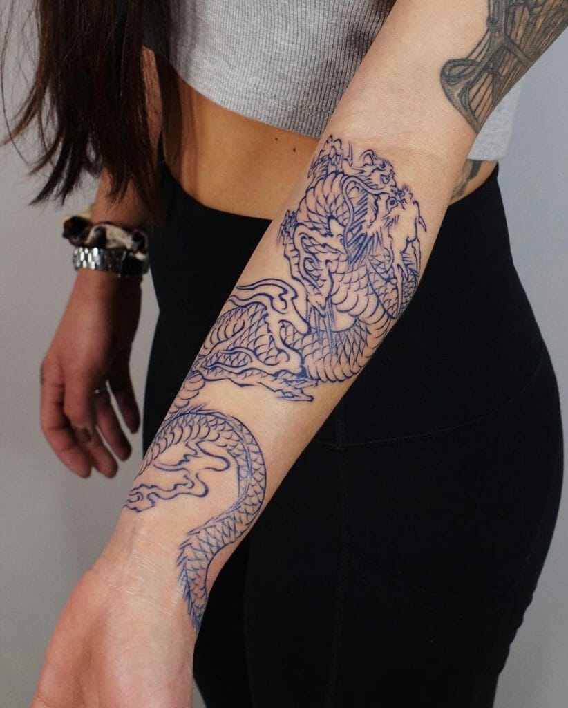 The girl with the dragon tattoo on her forearm.