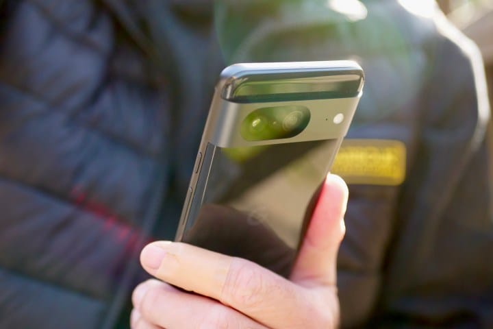 A person holding a Google Pixel 8.