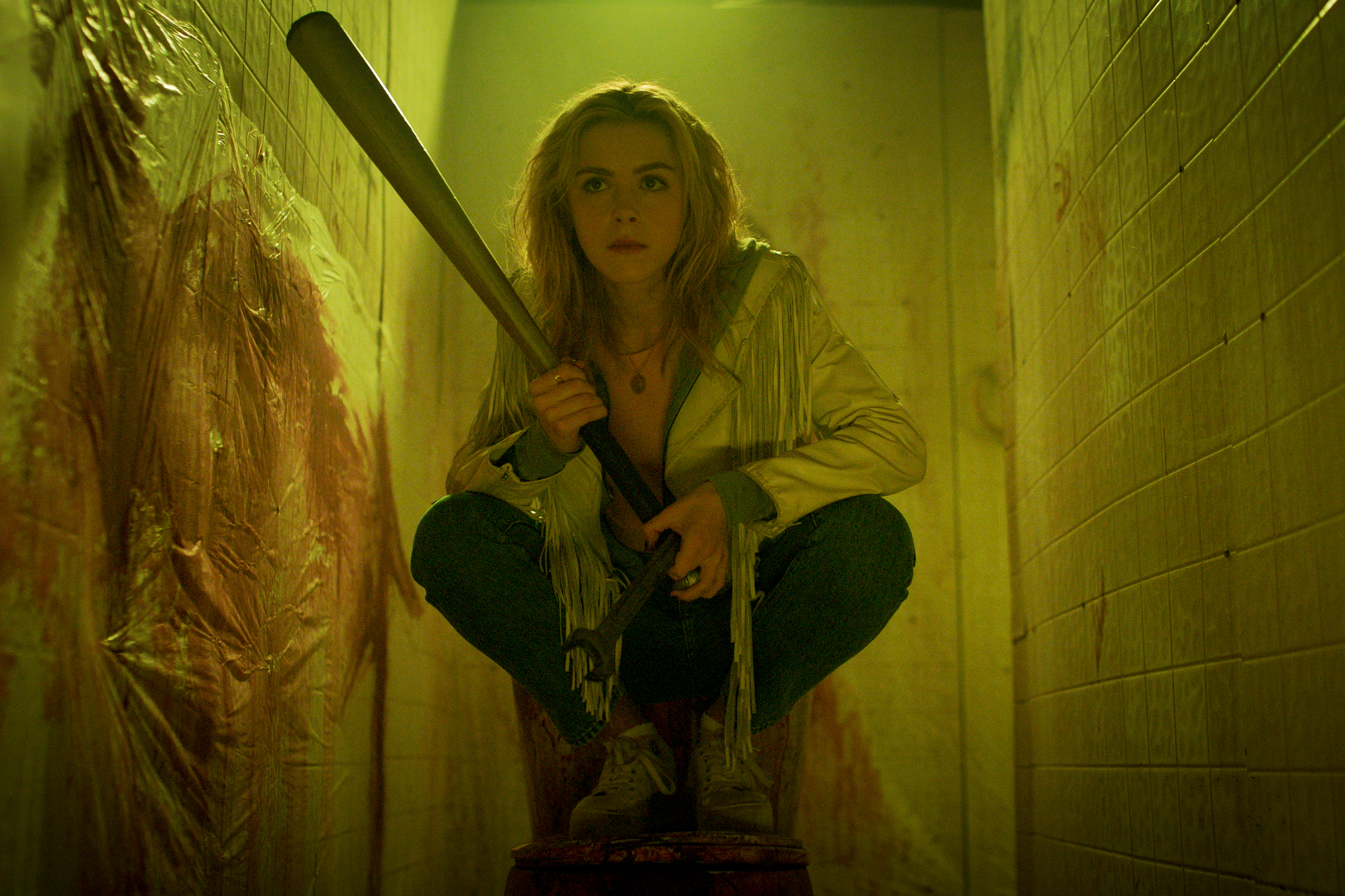 Totally Killer 2023 Movie Review Kiernan Shipka bows with bat