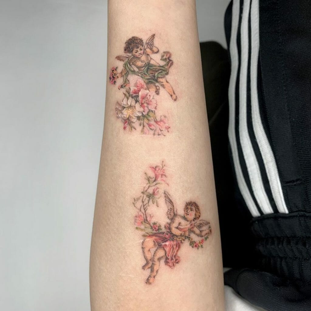 Tattoo of two little angels with floral design