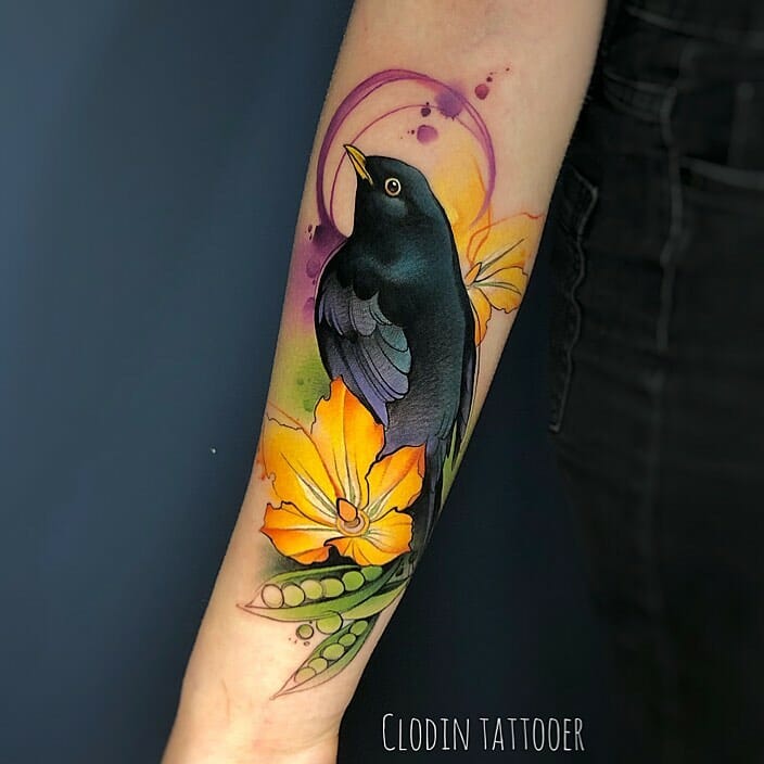 Vibrant Black Bird Tattoo