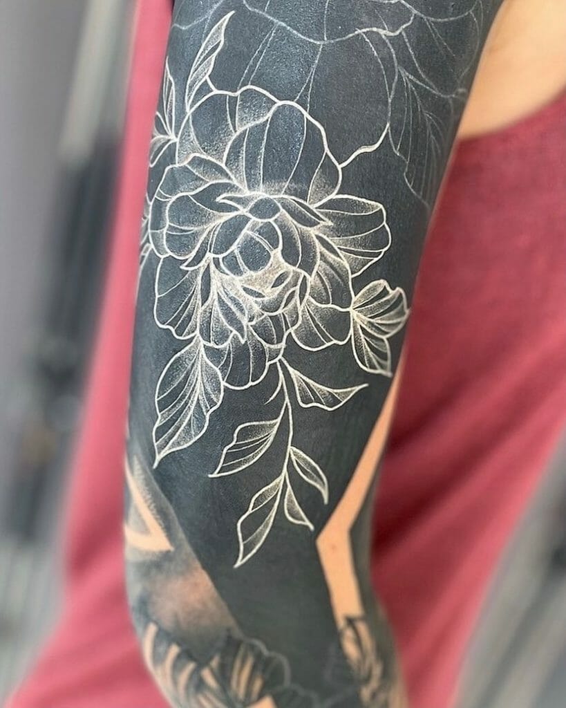 White on black sleeve tattoo