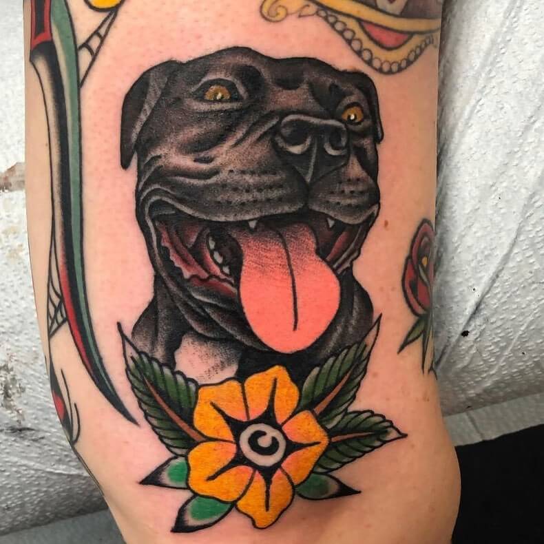 Happy Dog Portrait Tattoo with Yellow Flower Accent