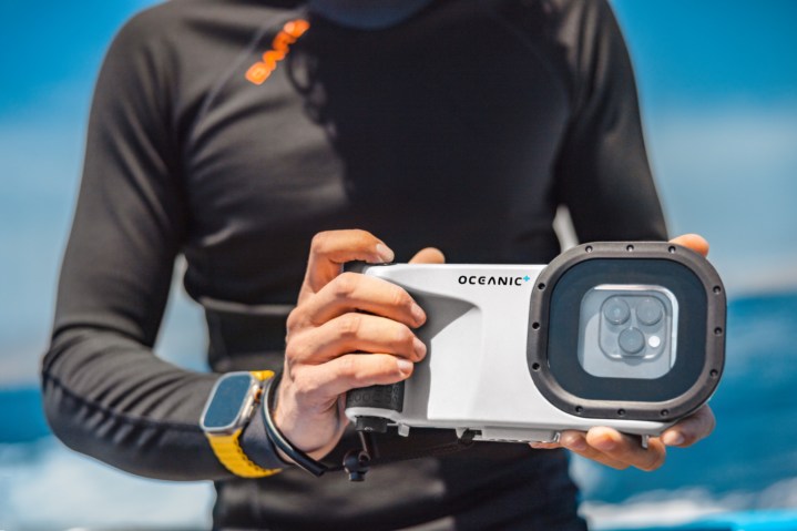 The man holding the Oceanic+ dive housing.