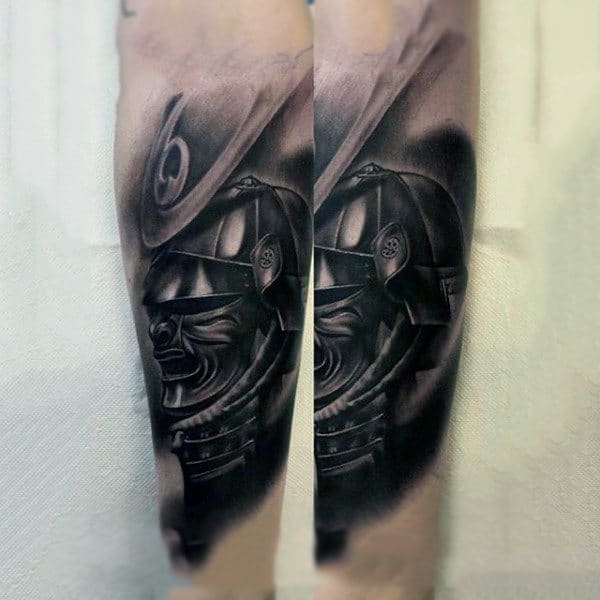 Realistic black and grey tattoo of a samurai helmet on forearm, symbolizing honor and strength