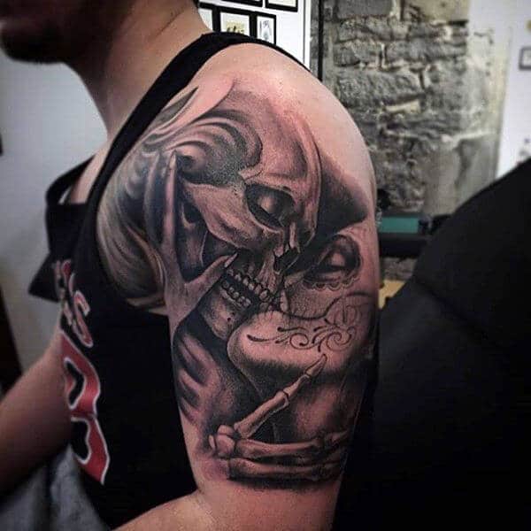 Realistic tattoo of skeletons embracing, symbolizing eternal love and mortality on the upper arm