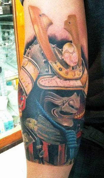 Detailed color tattoo of a samurai helmet on forearm, symbolizing warrior spirit and honor