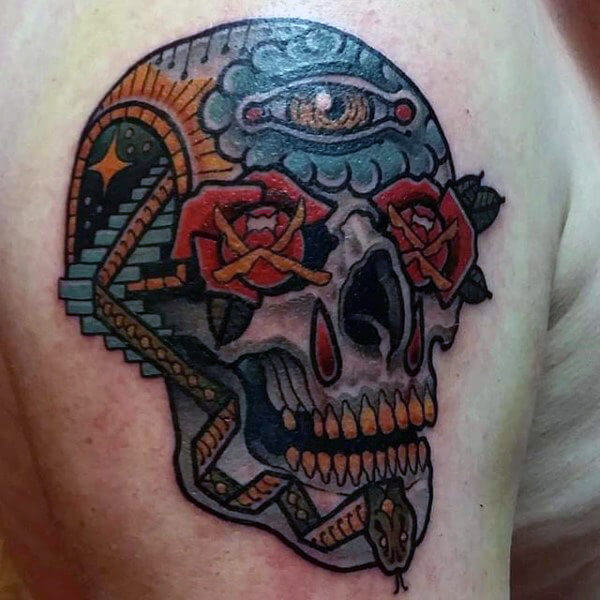 Colorful skull tattoo featuring an all-seeing eye, roses, and serpent with traditional design elements