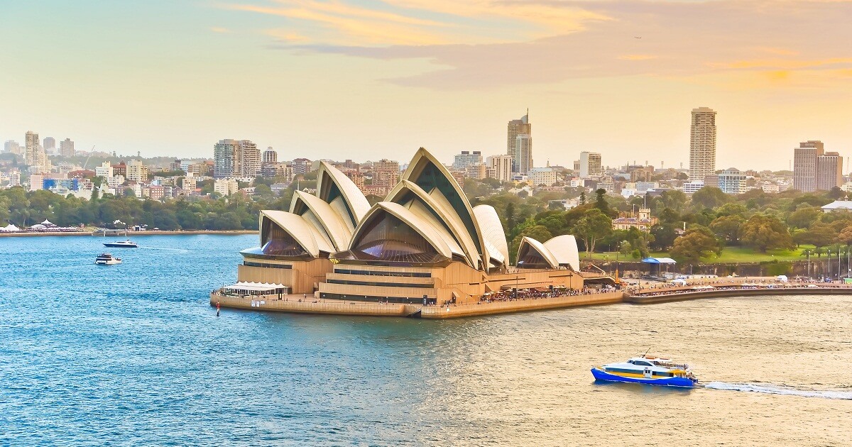 shutterstock 421397230 kw 050517 Ferries passing by the Sydney Opera House in Australia