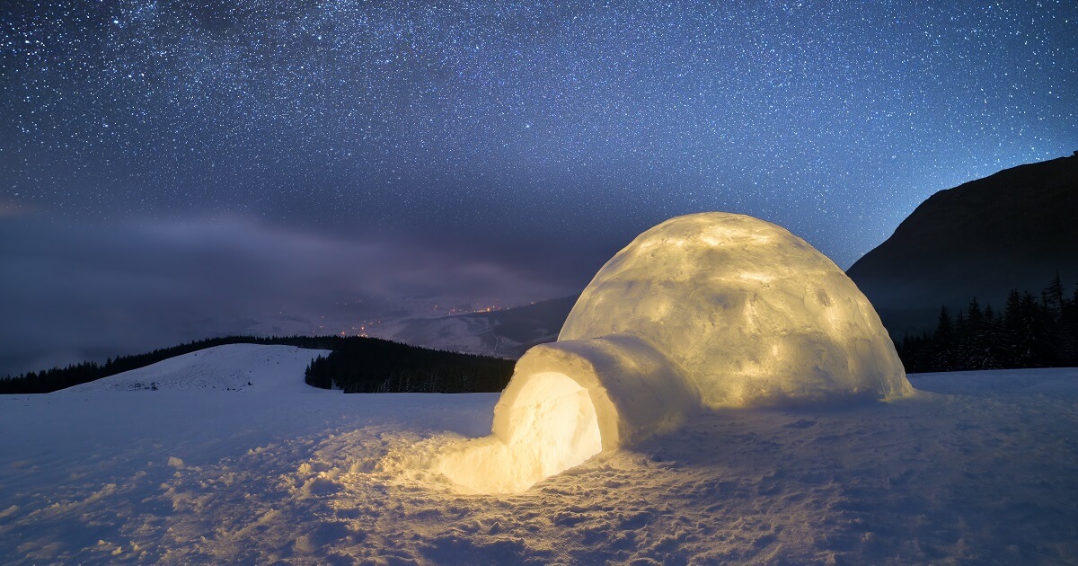 shutterstock 496337095 Night landscape with a snow igloo with light Copy