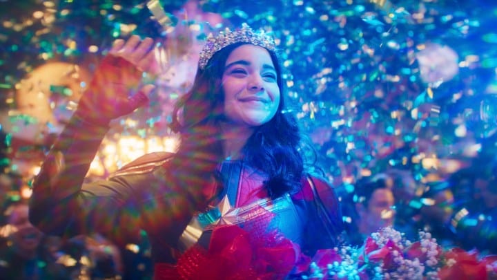 Kamala Khan, played by Iman Vellani, imagines confetti and a party all around her in a scene from Ms. Marvel.